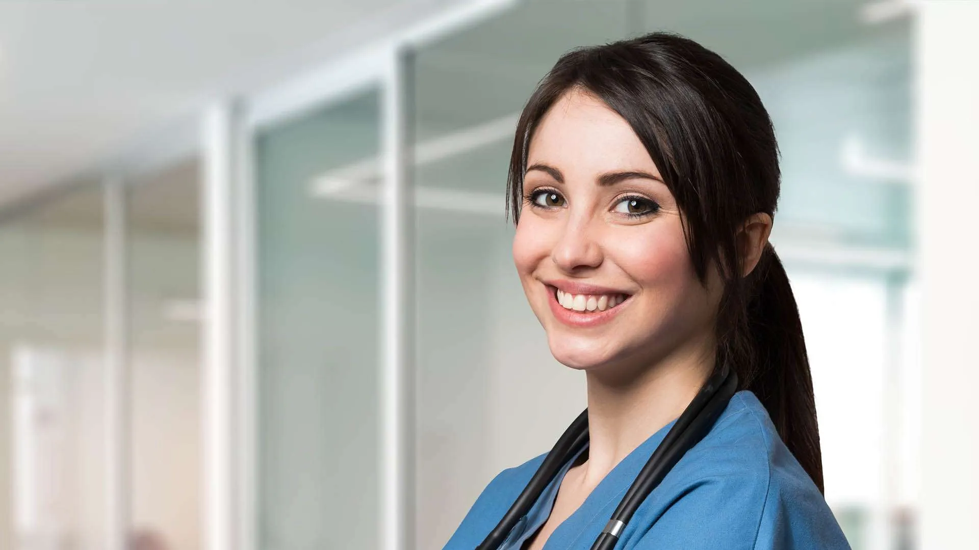A smiling DRMC volunteer nurse